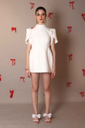 Ivory Bow-Back Mini Dress with Puff Sleeves – Pearl Button Detail - Vybtheory