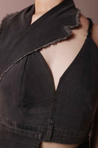 Detail of asymmetric denim corset top