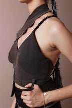 Side view of asymmetric denim halter corset top